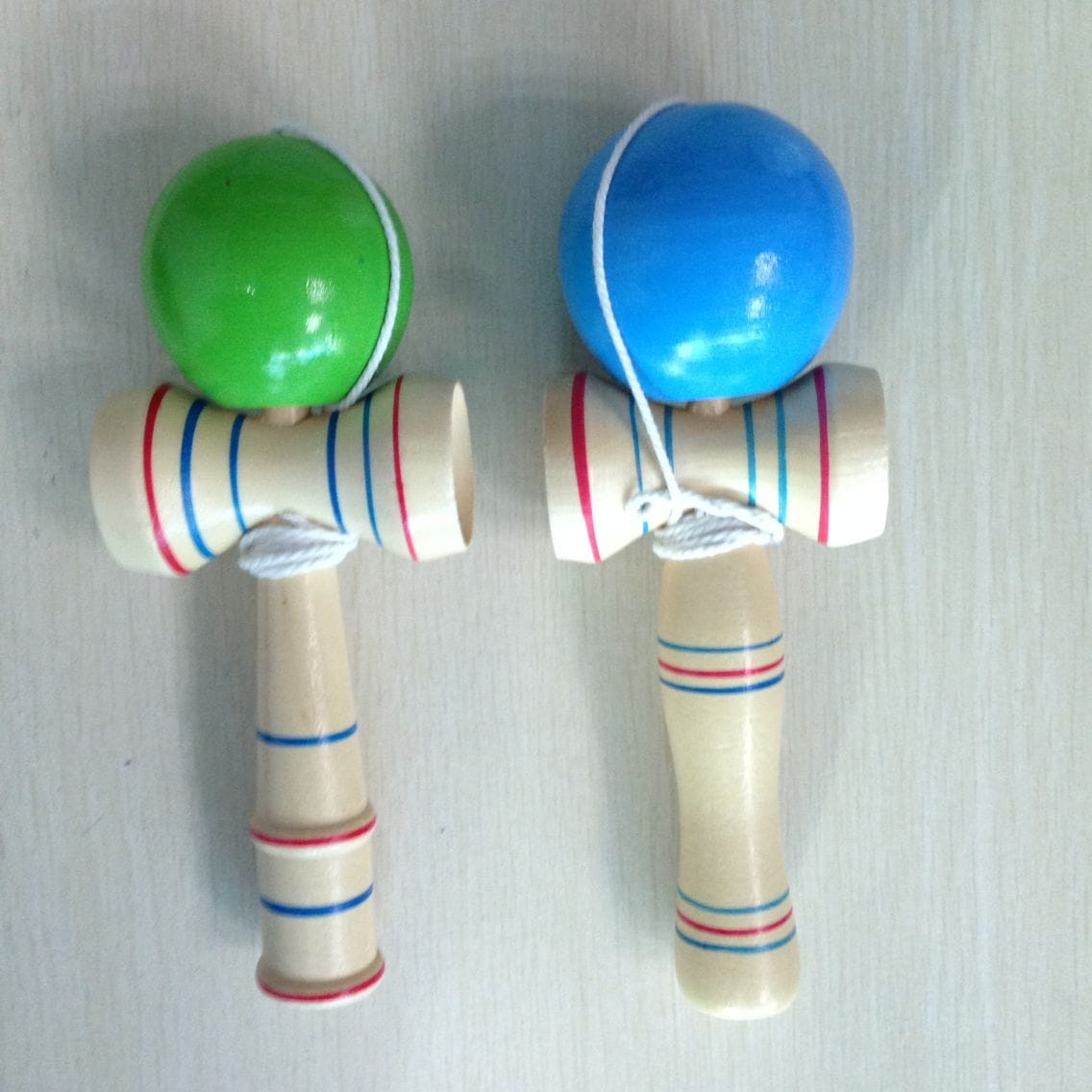 green and blue entry-level kendama wooden toy